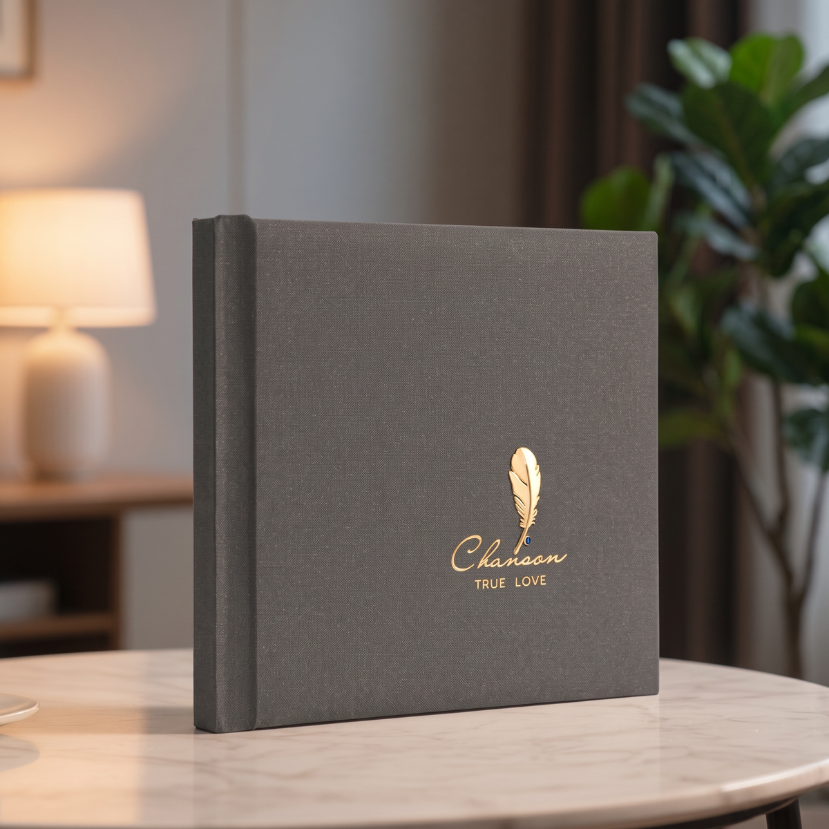 Custom vegan leather wedding photo album with 3D gold feather emblem, cover hero shot